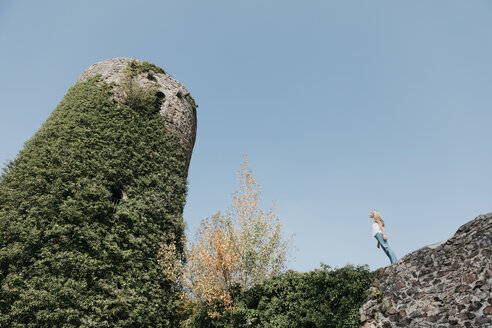 Germany, Black Forest, Sitzenkirch, young woman visiting Sausenburg Castle - LHPF00159