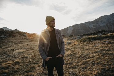 Mature man travelling through Switzerland, standing in nature - LHPF00194