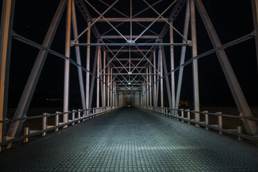 Empty bridge against clear sky at night - CAVF56485