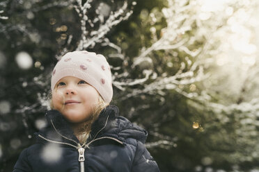 Cute girl wearing warm clothing while looking away - CAVF56543