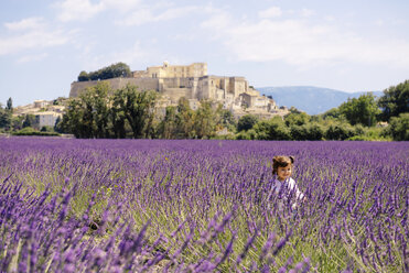 France, Grignan, happy baby girl in lavender field - GEMF02592