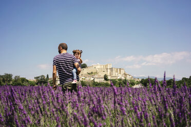 France, Grignan, father and little daughter together in lavender field - GEMF02608