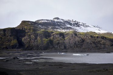 Scenic view of river by mountain against sky - CAVF56831