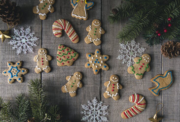 Overhead view of decorated gingerbread cookies on wooden table - CAVF56943