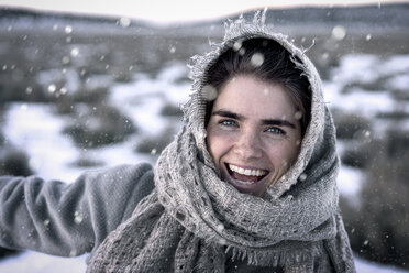 Close-up portrait of cheerful woman during winter - CAVF57358