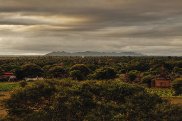 Scenic view of landscape against cloudy sky during sunset - CAVF57382