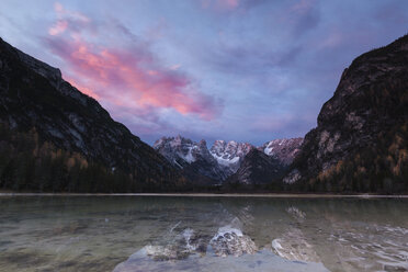 Scenic view of Lake Landro by mountains against sky at sunrise - CAVF57437