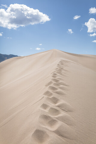 Scenic view of desert at Great Sand Dunes National Park against sky stock photo