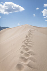 Scenic view of desert at Great Sand Dunes National Park against sky - CAVF57571