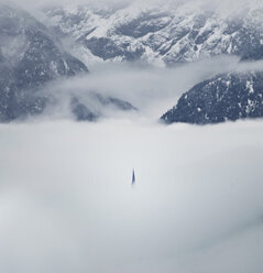 Scenic view of cloudy sky amidst snowcapped mountain - CAVF57814