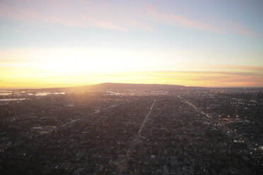Aerial view of cityscape against sky during sunset - CAVF57855
