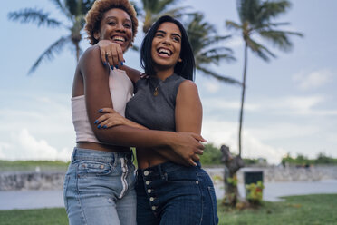 Two happy female friends hugging in a park - BOYF01215