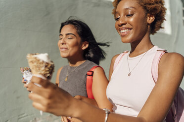 Two happy female friends with ice cream cones outdoors - BOYF01221