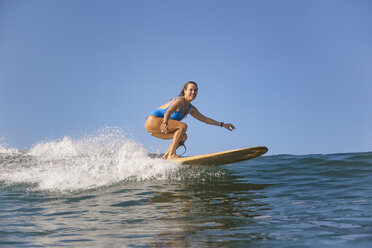 Indonesia, Bali, Batubolong beach, Pregnant woman, surfer in ocean - KNTF02457