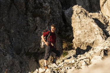 Mature man standing in the mountains, mountaineering in Austria - UUF16009