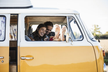 Affectionate couple doing a road trip in theit camper - UUF16163