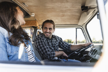 Affectionate couple doing a road trip in theit camper - UUF16166