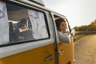 Happy couple doing a road trip in their camper - UUF16227