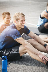 Sportive man during workout, laughing - HMEF00153