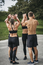 Sportive team making high five - HMEF00160