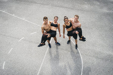 Sportive team, men holding women - HMEF00161