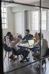 Business team having a meeting in loft office - GIOF04999