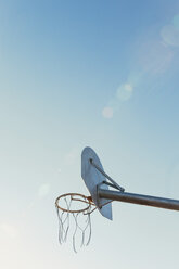 Low angle view of broken basketball hoop against sky - CAVF58316