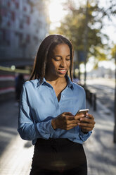 Businesswoman using smartphone - MAUF01865