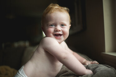 Portrait of cheerful baby boy at home - CAVF58514