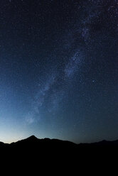 Silhouette mountain against sky at night - CAVF58631