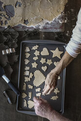 Overhead view of senior man and woman making Christmas cookies at home - CAVF58827