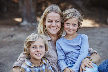 Portrait of happy mother with two sons outdoors - SSCF00106