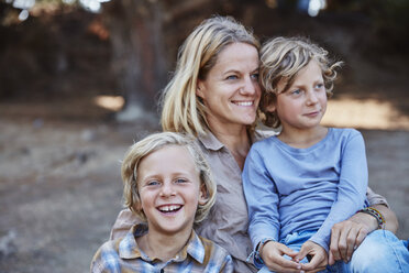 Portrait of happy mother with two sons outdoors - SSCF00107
