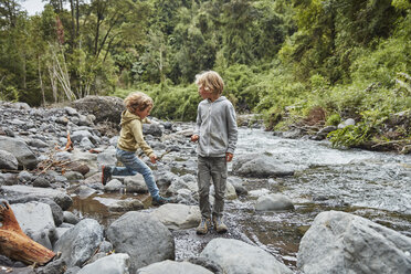 Chile, Patagonia, Osorno Volcano, Las Cascadas waterfall, two boys playing at a river - SSCF00178