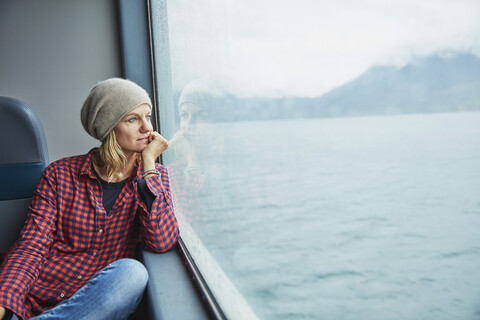 Chile, Hornopiren, woman looking out of window of a ferry stock photo