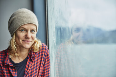 Chile, Hornopiren, portrait of woman at the window of a ferry - SSCF00202