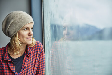 Chile, Hornopiren, portrait of woman looking out of window of a ferry - SSCF00203