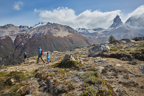 Chile, Cerro Castillo, mother with two sons on a hiking trip in the mountains stock photo
