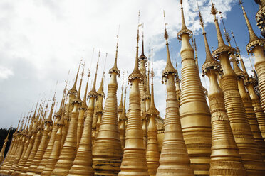 Low angle view of stupas at Shwe Indein Pagoda against sky - CAVF59245