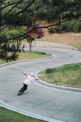 High angle view of man skateboarding at park - CAVF59445
