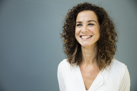 Portrait of a beautiful woman, laughing stock photo