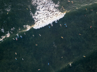 Indonesia, Bali, Canggu, Aerial view of surfers at Batu bologna beach - KNTF02520