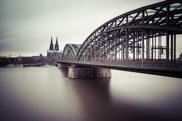 Germany, Cologne, view to Cologne Cathedral with Hohenzollern Bridge and Rhine River in the foreground - SKAF00068