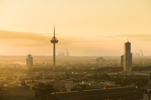 Germany, Cologne, silhouette of Uni-Center, television tower and Cologne tower at dawn stock photo