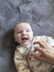 Mother tickling her laughing baby girl - LAF02190