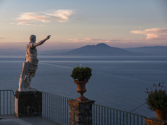 Italy, Campania, Capri, Gulf of Naples, Statue and Vesuv in the background - AMF06361