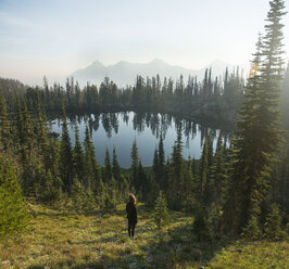 High angle view of woman on mountain at Sawtooth Range against sky - CAVF59848