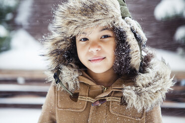 Portrait of confident girl wearing warm clothing during winter - CAVF60285