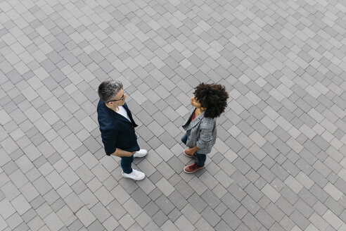 Top view of two colleagues talking on a square - JRFF02213