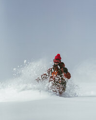 Hiker skiing on ski slope against sky during winter - CAVF60601